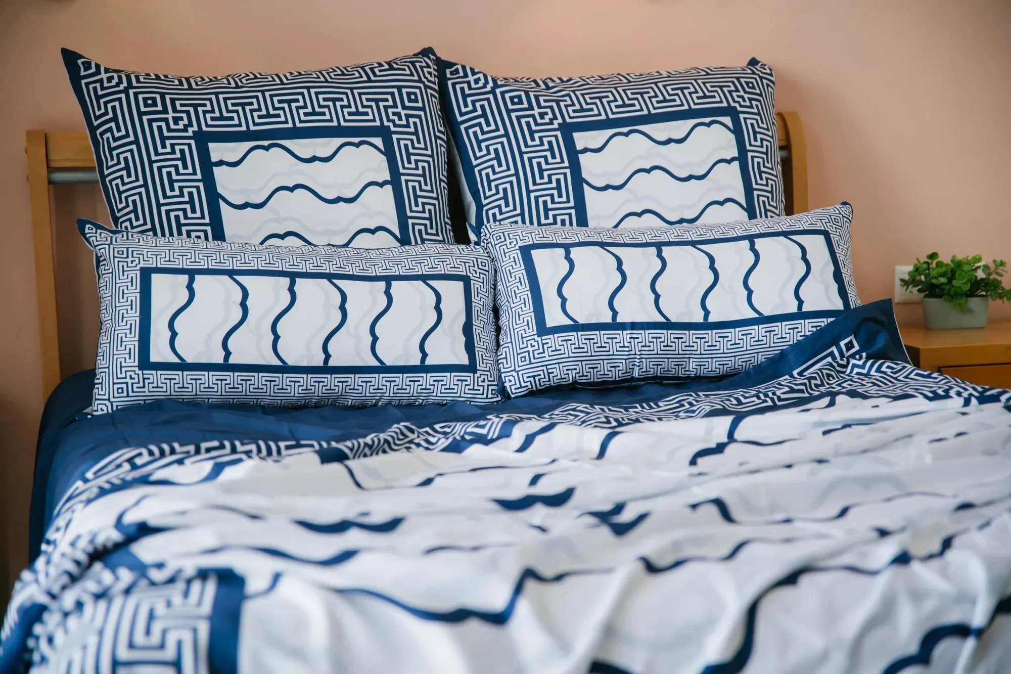Cycladic Serenity pillowcases with wave lines and a key border