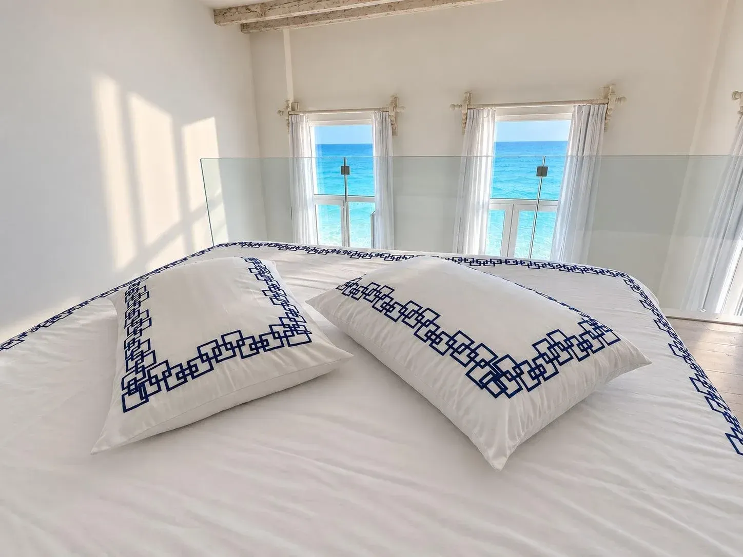 A Desmos sheet draped over a seafront balcony wall