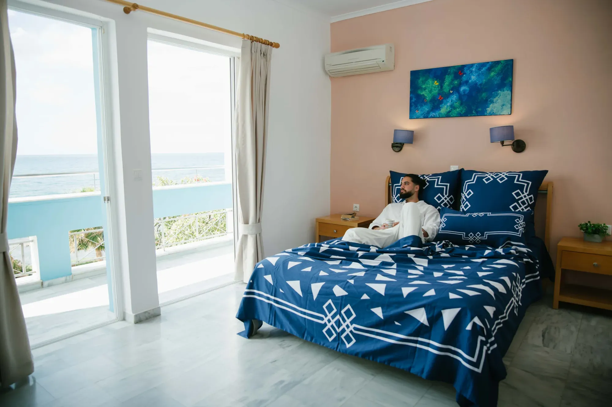 A man lying on a bed made in Mythos Tides