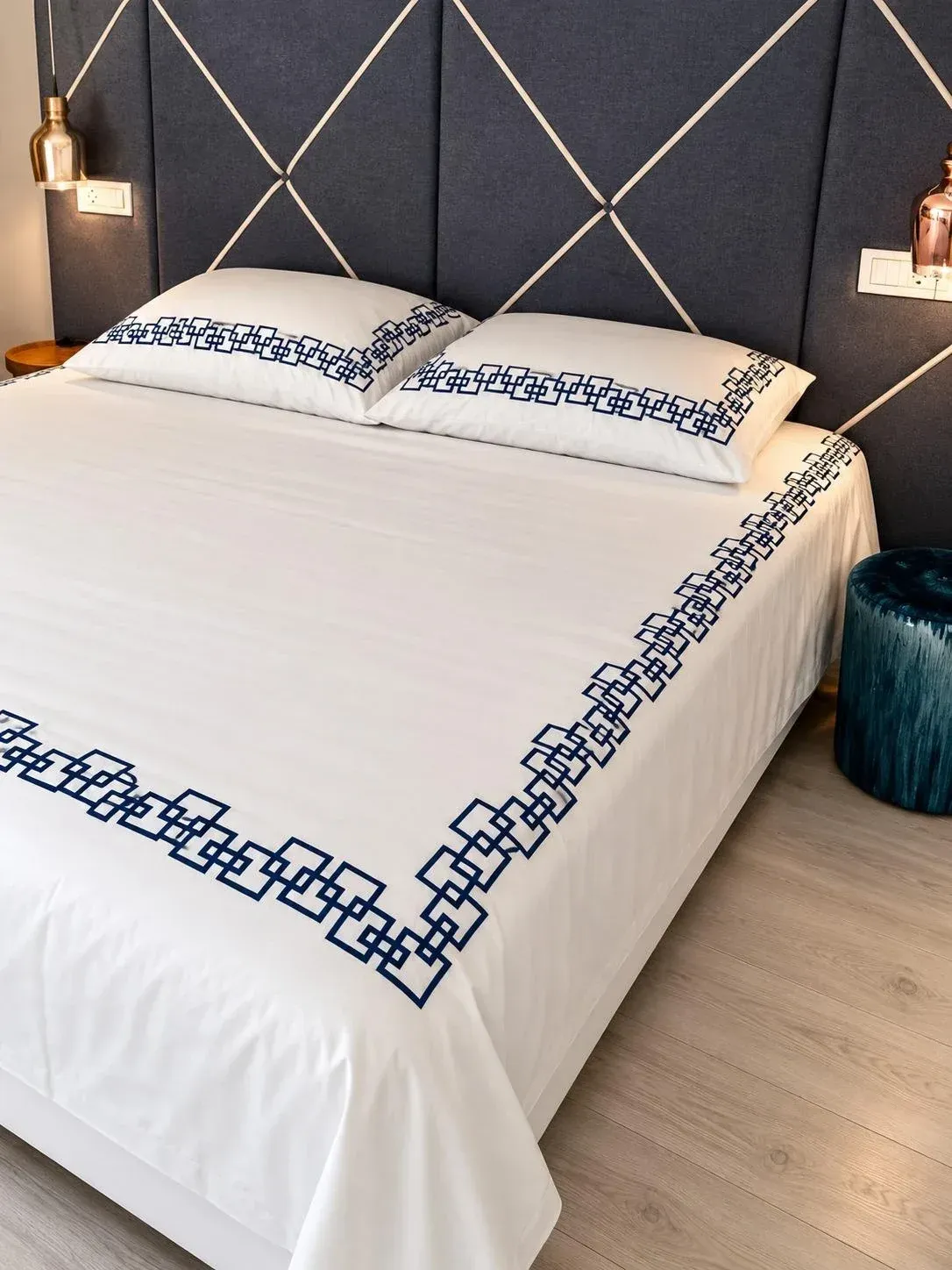 Desmos pillowcases side by side, the sea through the balcony doors