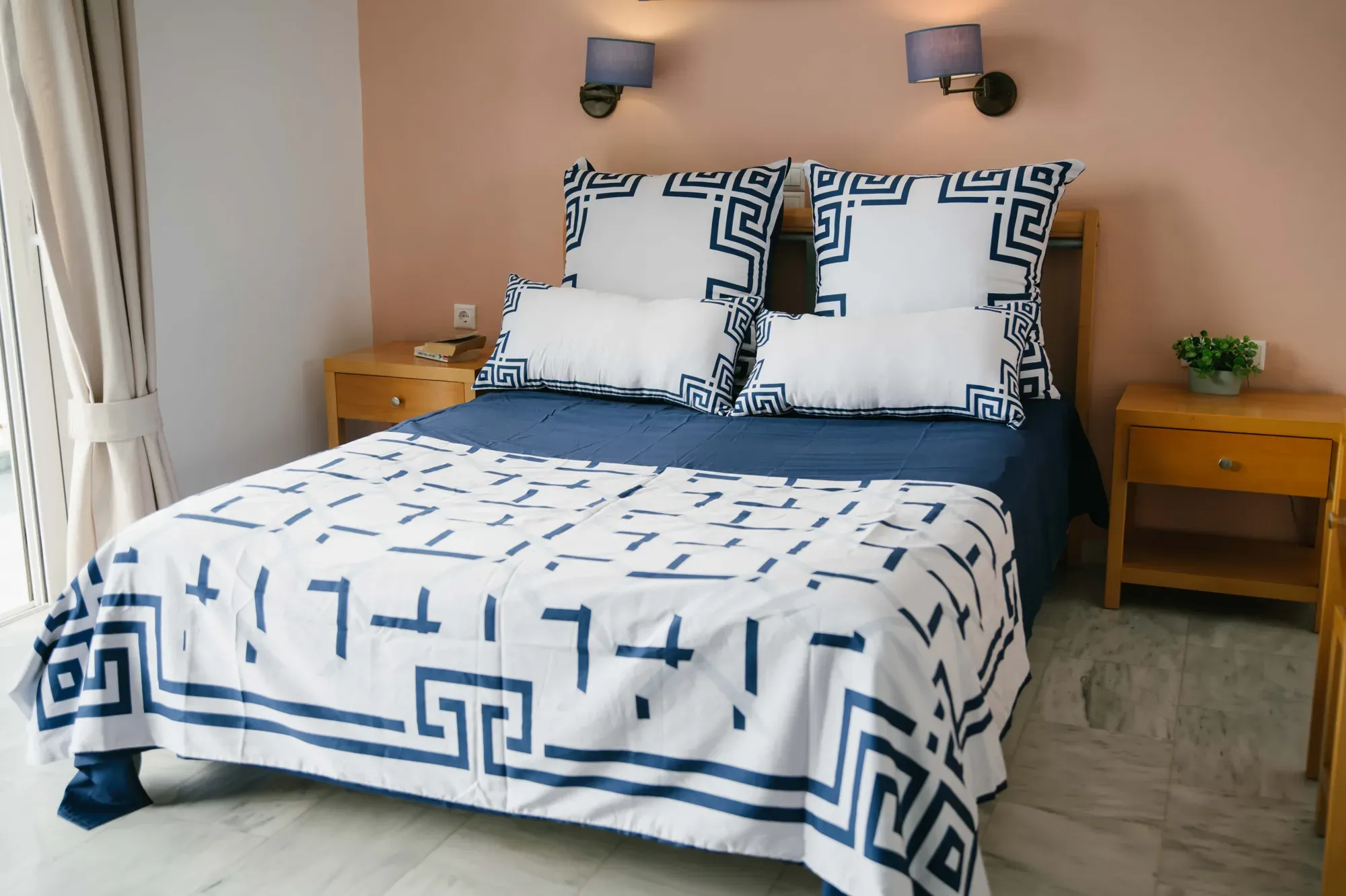 Ionian Harmony folded on a wooden stool with the navy keepsake box, by the sea